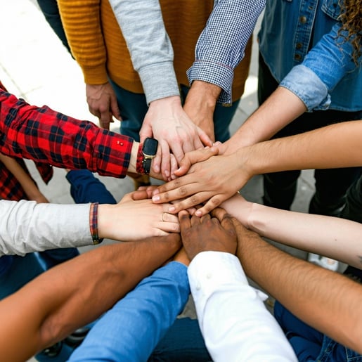 group of all ethnicity hands that celebrate a successful event